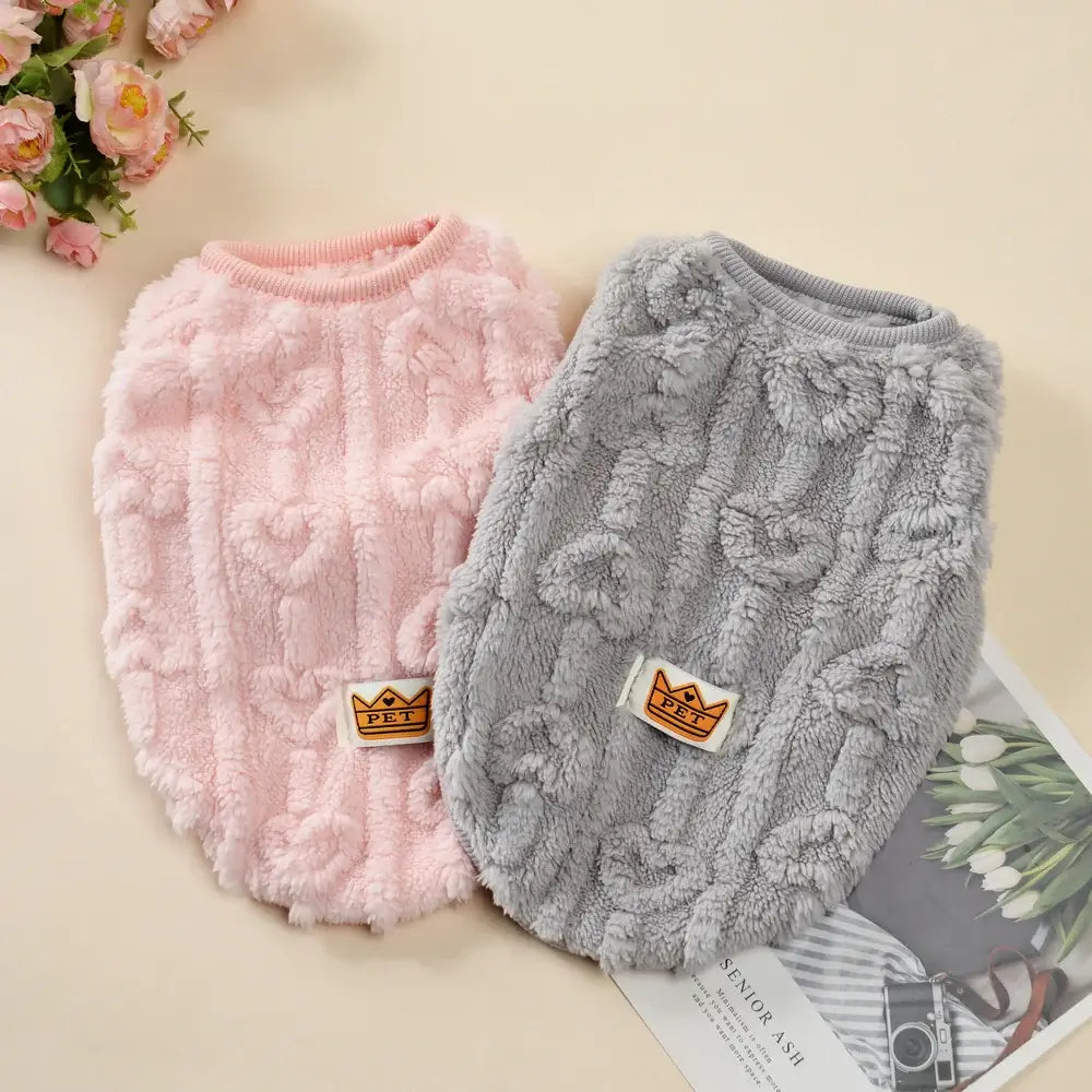 This image shows the colors of dog fleece jacket available in pink & grey