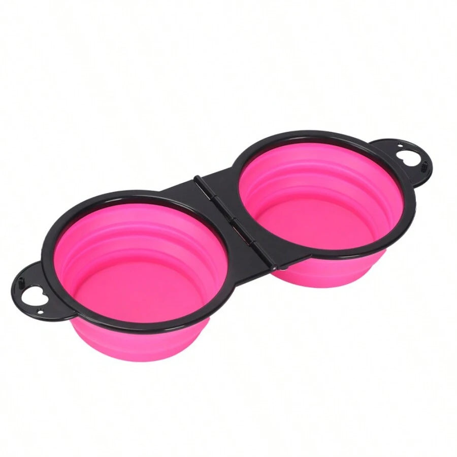 Pink collapsible dog bowls with black holder on a white background

