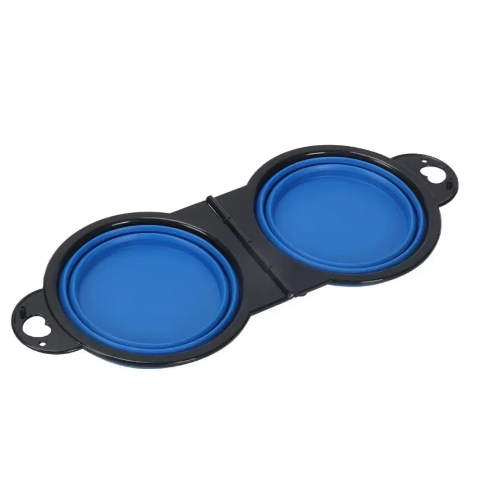 Collapsible dog bowls with blue silicone lids on a white background

