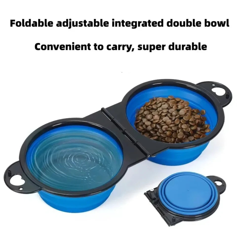 Foldable adjustable integrated double bowl with blue silicone bowls containing pet food on a white background.

