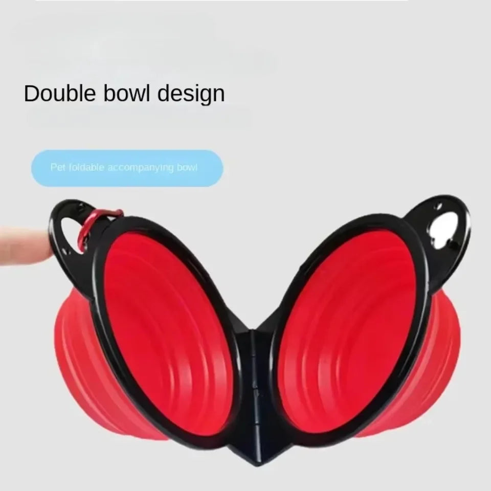 Red double bowl design with black handles on a gray background

